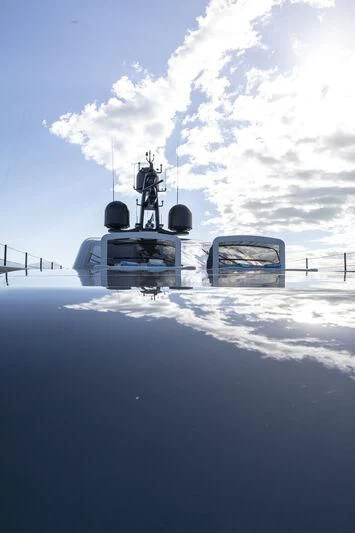 a person standing on a boat in the water aboard RUSH Yacht for Sale