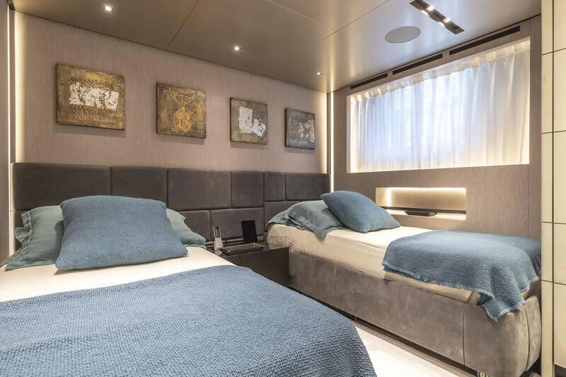 a room with two beds aboard RUSH Yacht for Sale