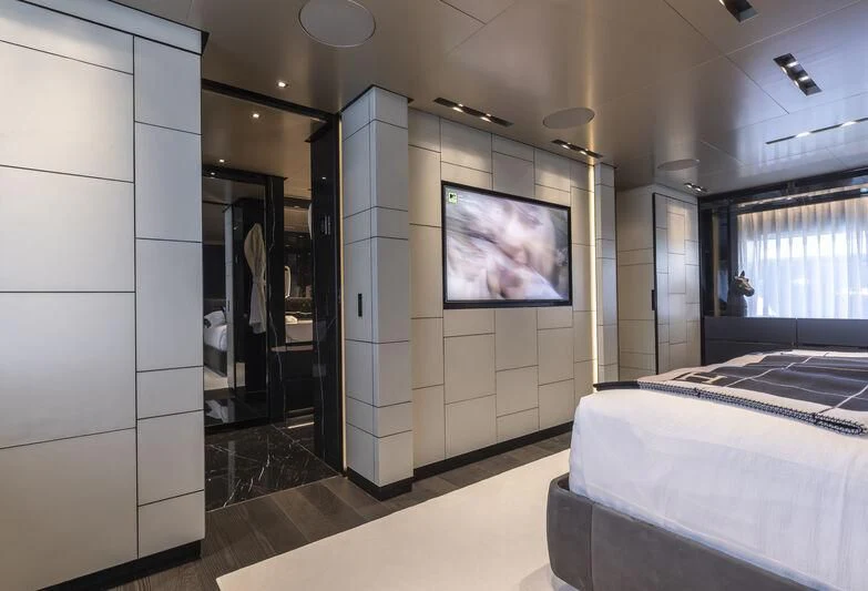 a room with a tv and a bed aboard RUSH Yacht for Sale