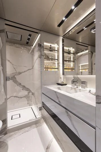 a bathroom with a glass shower aboard RUSH Yacht for Sale