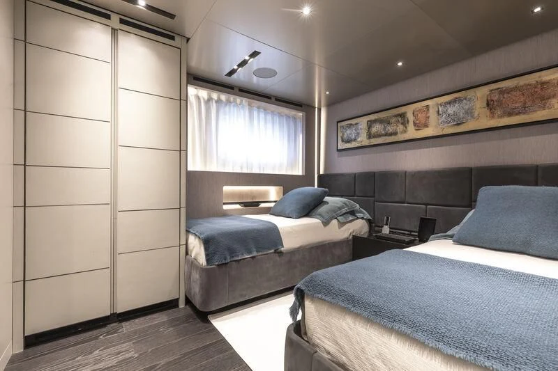 a room with two beds aboard RUSH Yacht for Sale