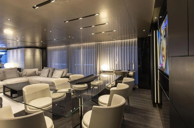 a living room with a large screen aboard RUSH Yacht for Sale