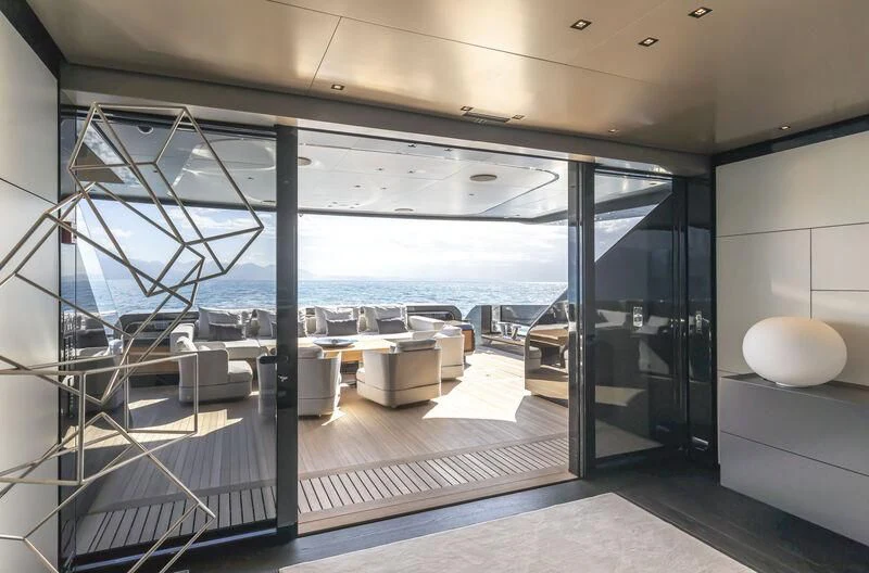 a room with a view of the ocean and the deck aboard RUSH Yacht for Sale