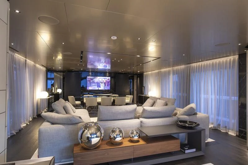 a living room with a large screen aboard RUSH Yacht for Sale