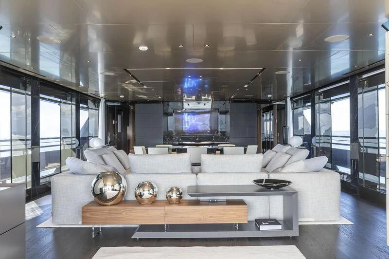 a living room with a large screen aboard RUSH Yacht for Sale