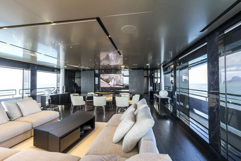 a room with a couch and a table and chairs aboard RUSH Yacht for Sale