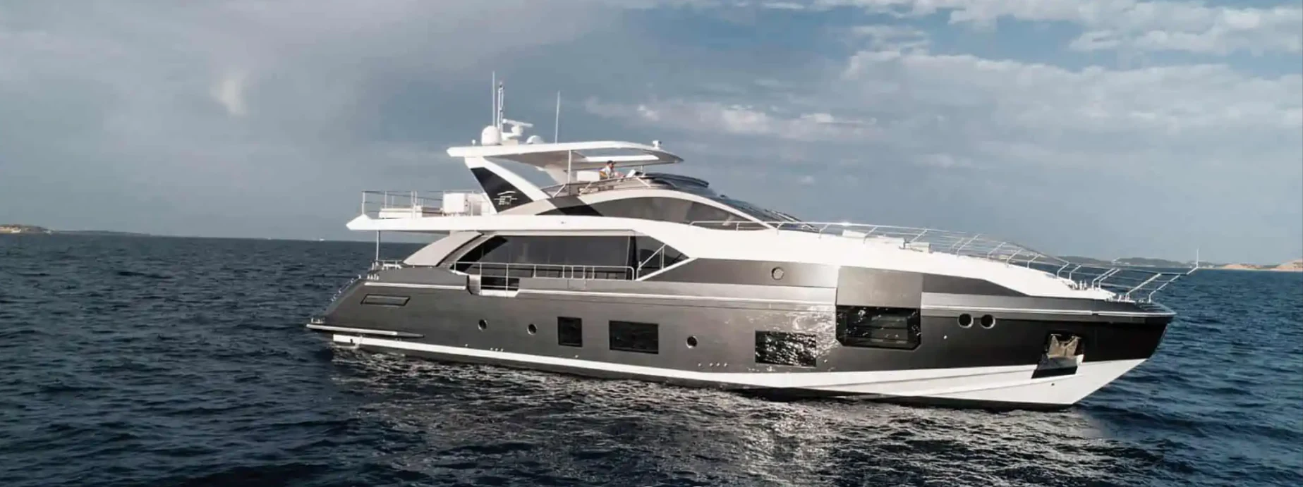 a white yacht on the water aboard AZIMUT GRANDE 27/66 Yacht for Sale