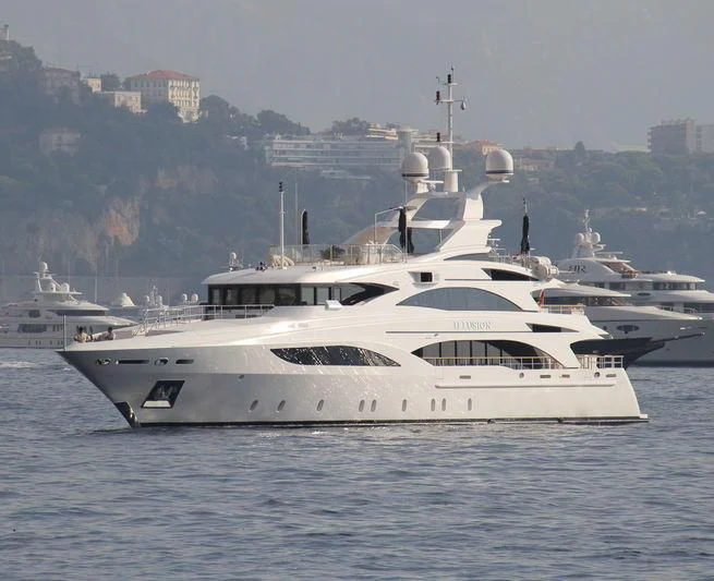 a group of white yachts in the water aboard WILD ORCHID I Yacht for Sale