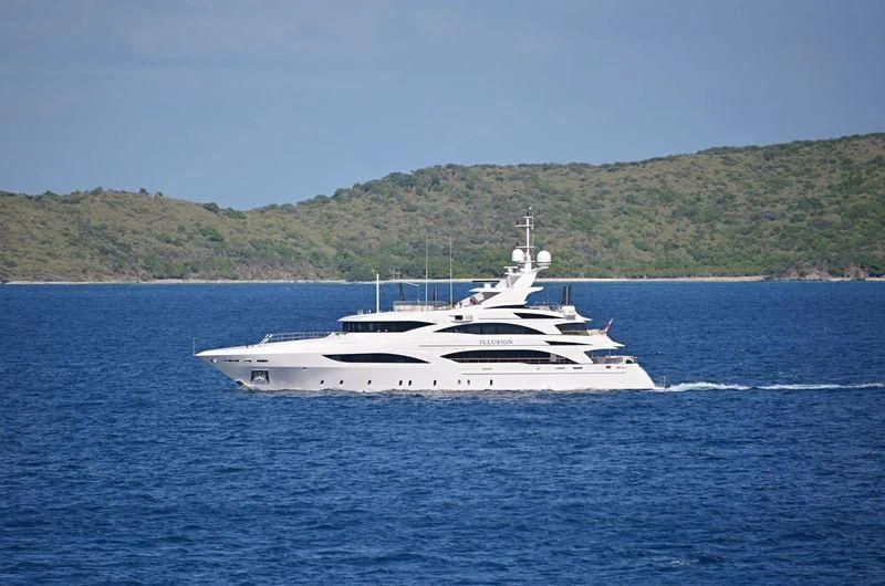 a white boat on the water aboard WILD ORCHID I Yacht for Sale