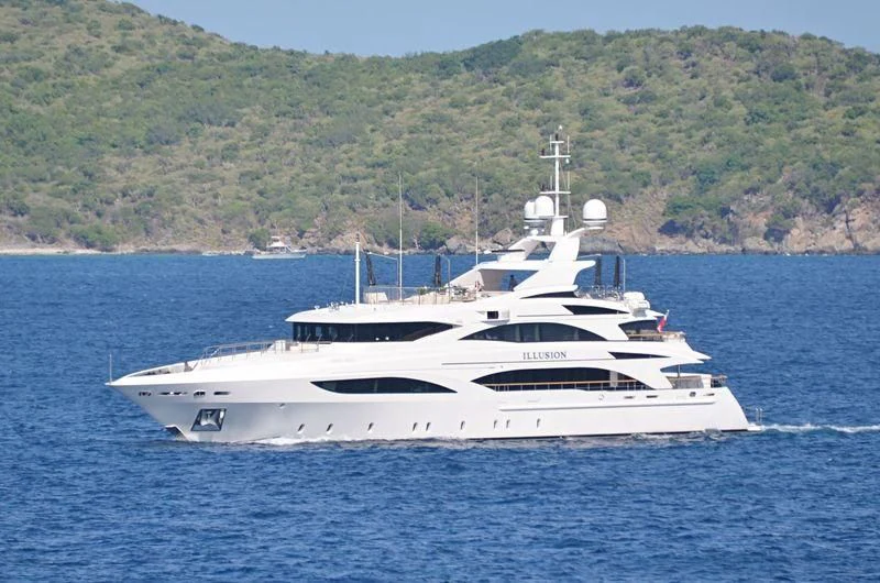 a white yacht on the water aboard WILD ORCHID I Yacht for Sale