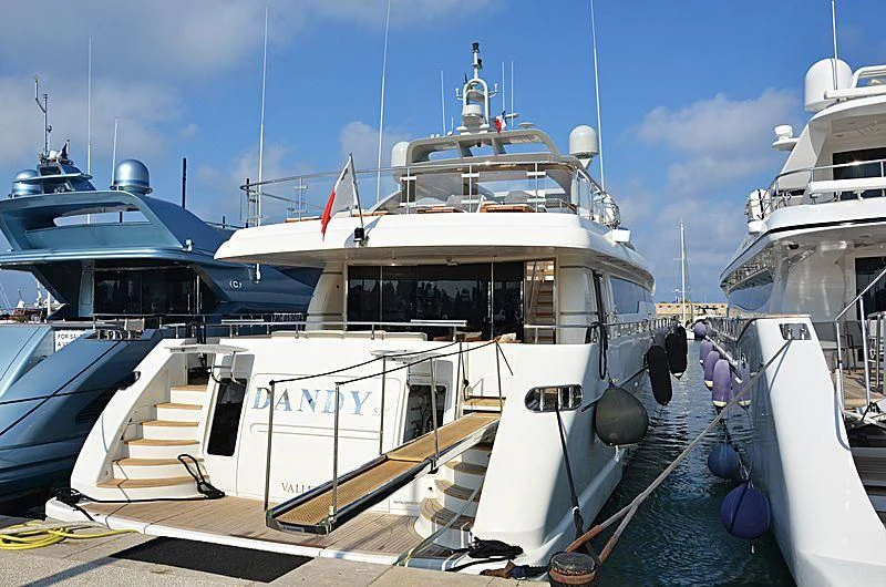 a boat docked at a pier aboard DANDY SIX Yacht for Sale
