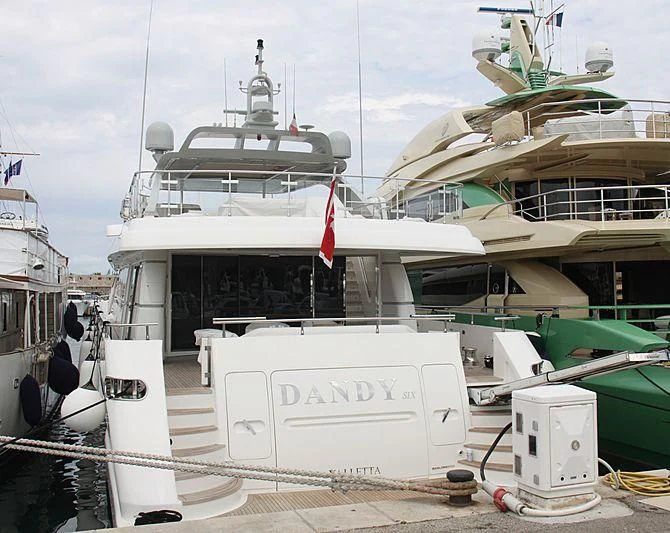a large white boat docked aboard DANDY SIX Yacht for Sale