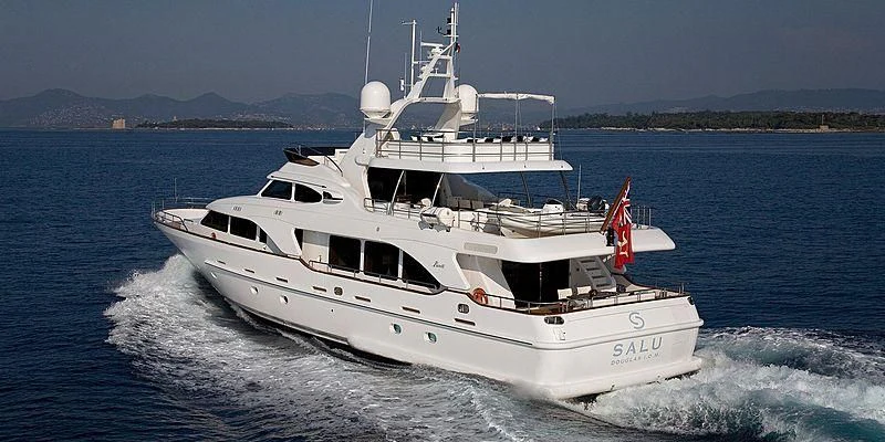 a white boat on the water aboard SALUTE Yacht for Sale