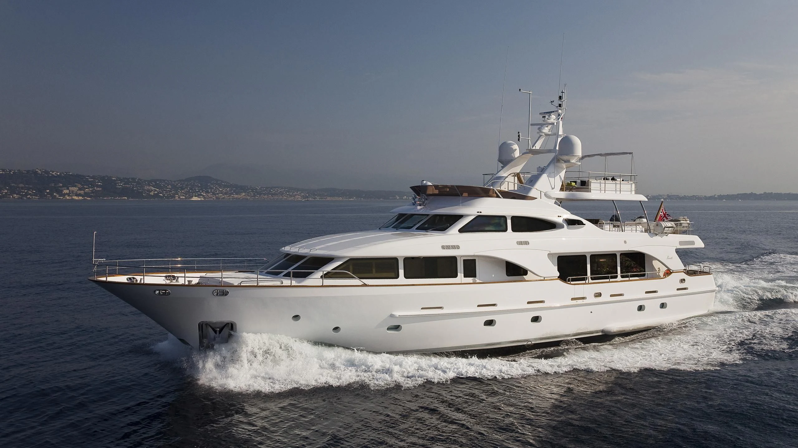 a white yacht on the water aboard SALUTE Yacht for Sale