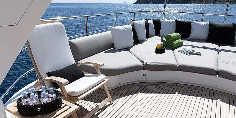 a white couch with pillows and pillows aboard SALUTE Yacht for Sale