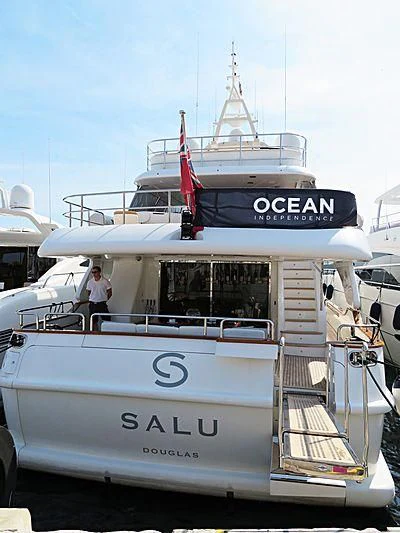 a boat with a flag on the front aboard SALUTE Yacht for Sale