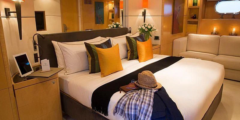 a person sitting in a bed aboard SALUTE Yacht for Sale