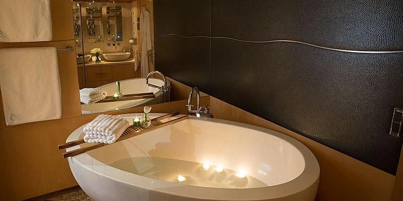 a bathroom with a sink and mirror aboard SALUTE Yacht for Sale