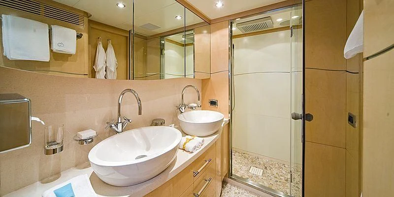 a bathroom with two sinks aboard SALUTE Yacht for Sale
