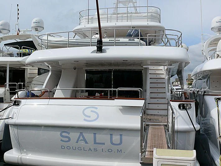 a white boat with a white stripe aboard SALUTE Yacht for Sale