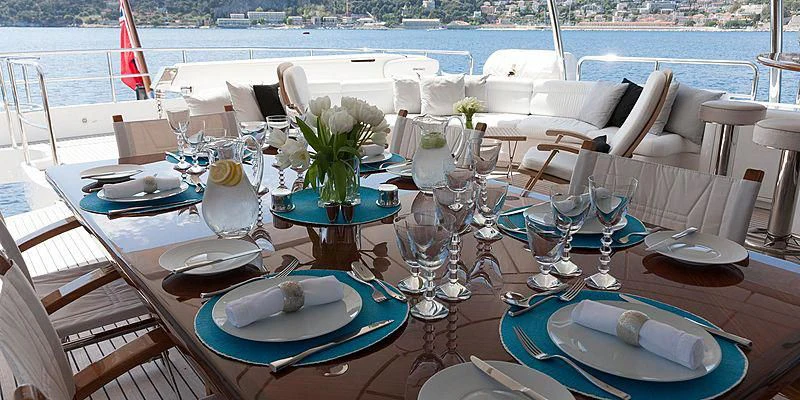 a table set for a dinner aboard SALUTE Yacht for Sale