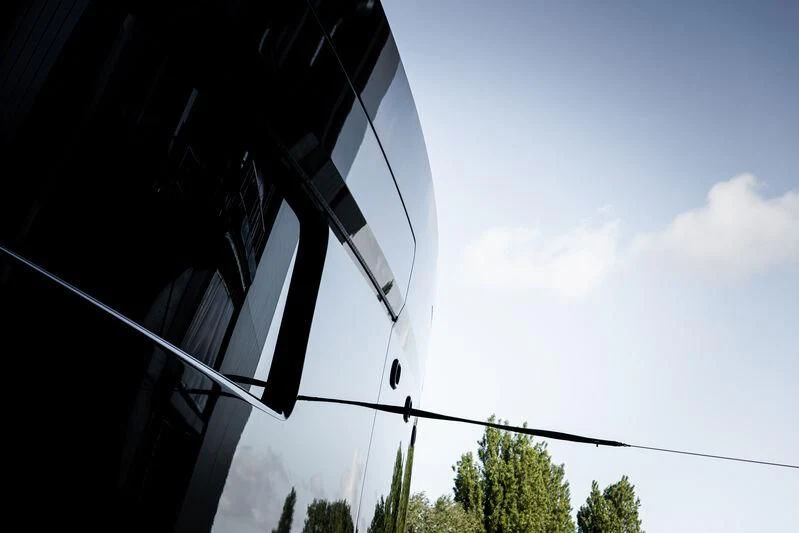 a building with a large window aboard B Yacht for Sale