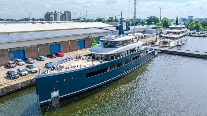 a large ship docked aboard B Yacht for Sale