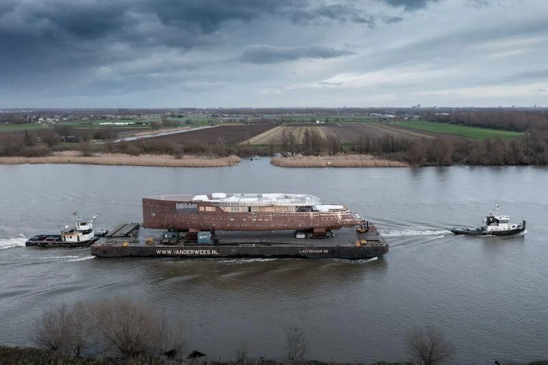 a barge on the water aboard B Yacht for Sale