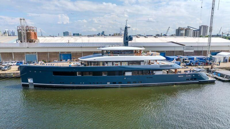 a large boat in a harbor aboard B Yacht for Sale