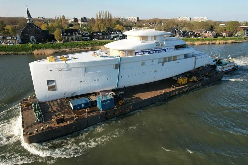 a large boat on the water aboard B Yacht for Sale