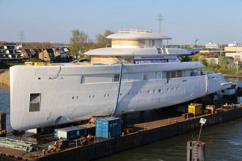 a large white ship docked aboard B Yacht for Sale