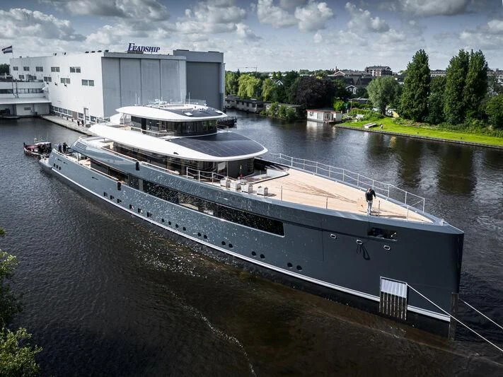 a large ship docked aboard B Yacht for Sale