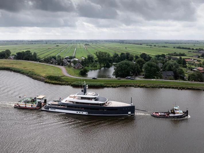 boats on a river aboard B Yacht for Sale