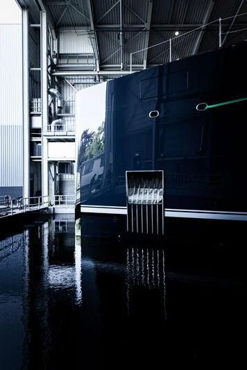 a large blue container in a body of water aboard B Yacht for Sale