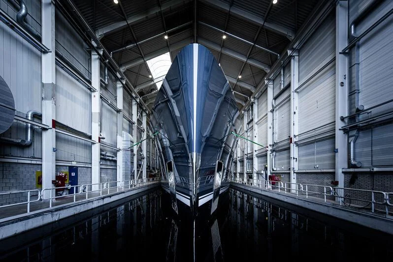 a large metal structure in a factory aboard B Yacht for Sale
