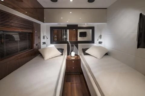 a room with a bed and a window aboard PALUMBA Yacht for Sale