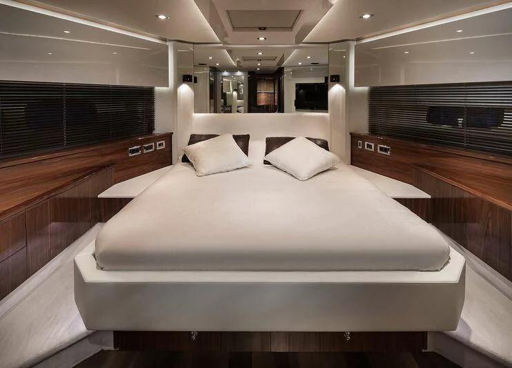 a large bed in a room aboard PALUMBA Yacht for Sale
