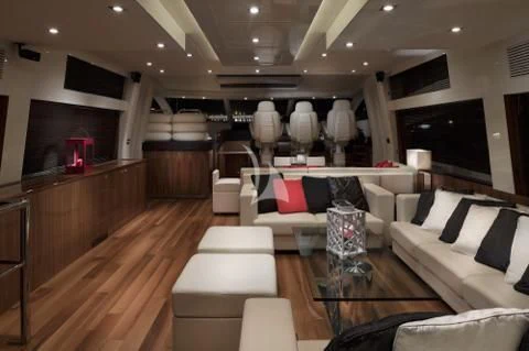 a living room with a wood floor aboard PALUMBA Yacht for Sale