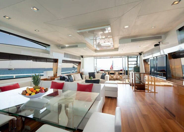 a room with a table and chairs aboard PALUMBA Yacht for Sale
