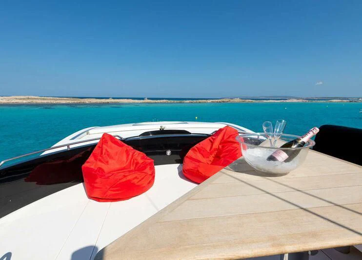 a boat with a red umbrella on it aboard PALUMBA Yacht for Sale