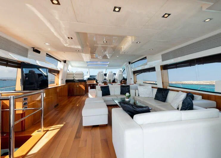 a living room with a large window aboard PALUMBA Yacht for Sale