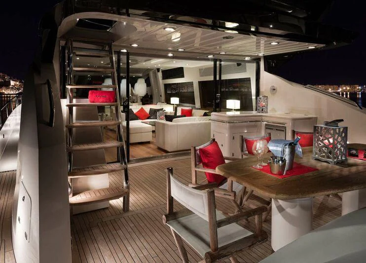 a room with a table and chairs aboard PALUMBA Yacht for Sale