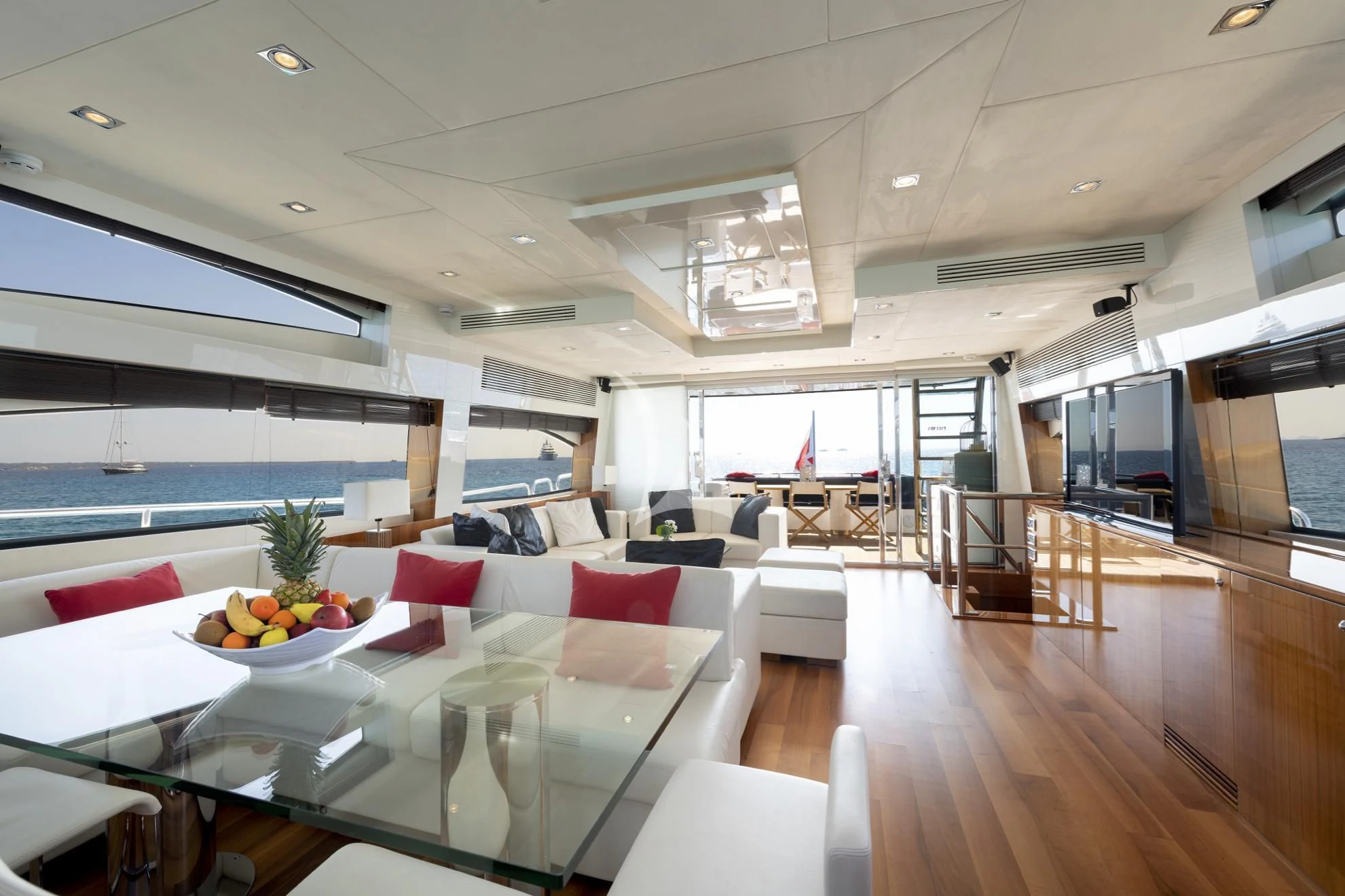 a room with a table and chairs aboard PALUMBA Yacht for Sale