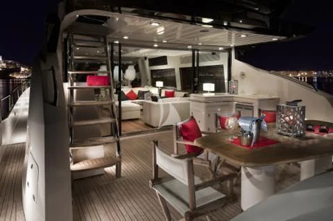 a room with a table and chairs aboard PALUMBA Yacht for Sale