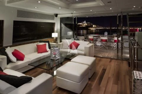 a living room with a large screen aboard PALUMBA Yacht for Sale