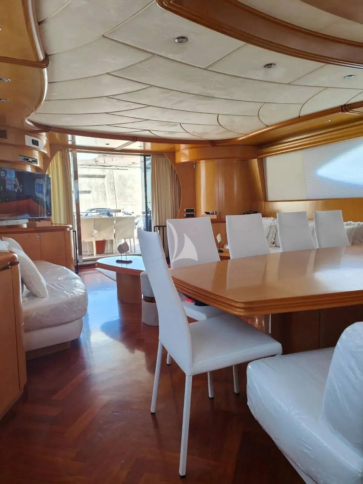 a dining table in a room aboard LADY A Yacht for Charter