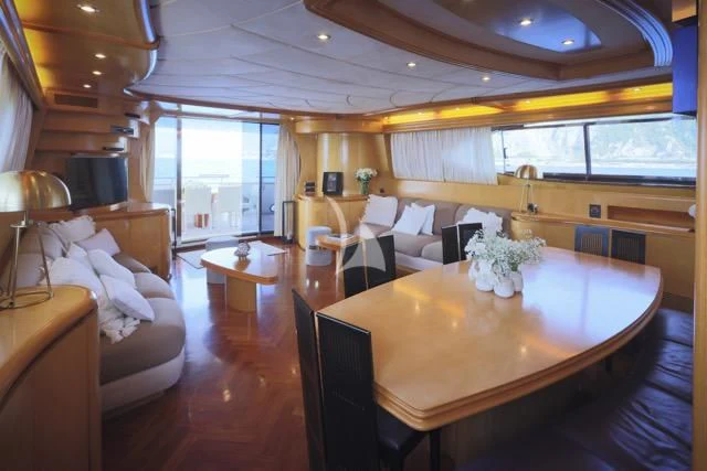 a large living room with a table and chairs aboard LADY A Yacht for Charter
