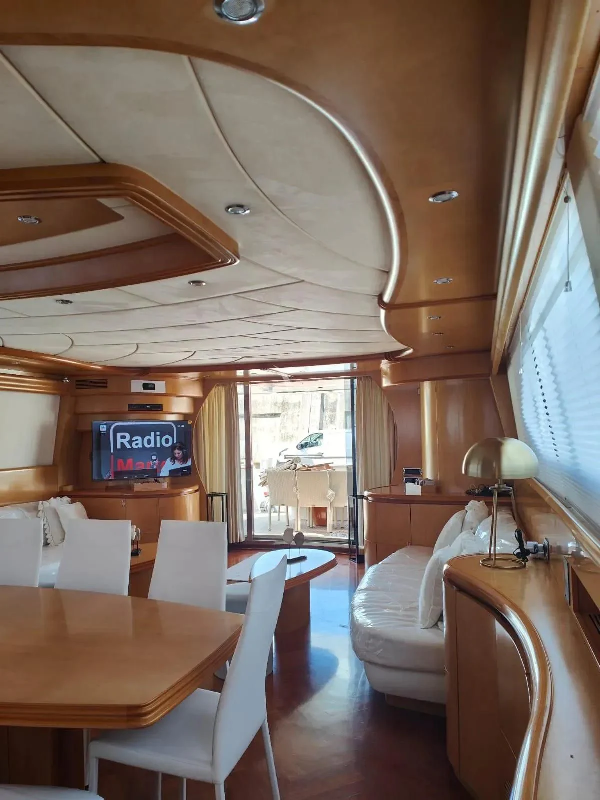 a room with tables and chairs aboard LADY A Yacht for Charter