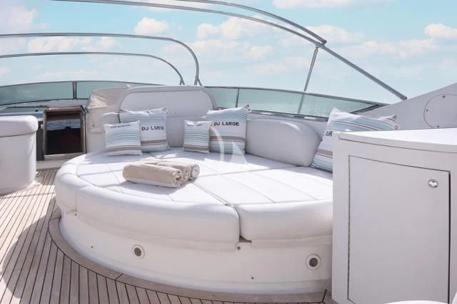 a white boat on a deck aboard LADY A Yacht for Charter