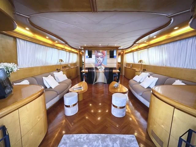 a room with a bed and a couch aboard LADY A Yacht for Charter
